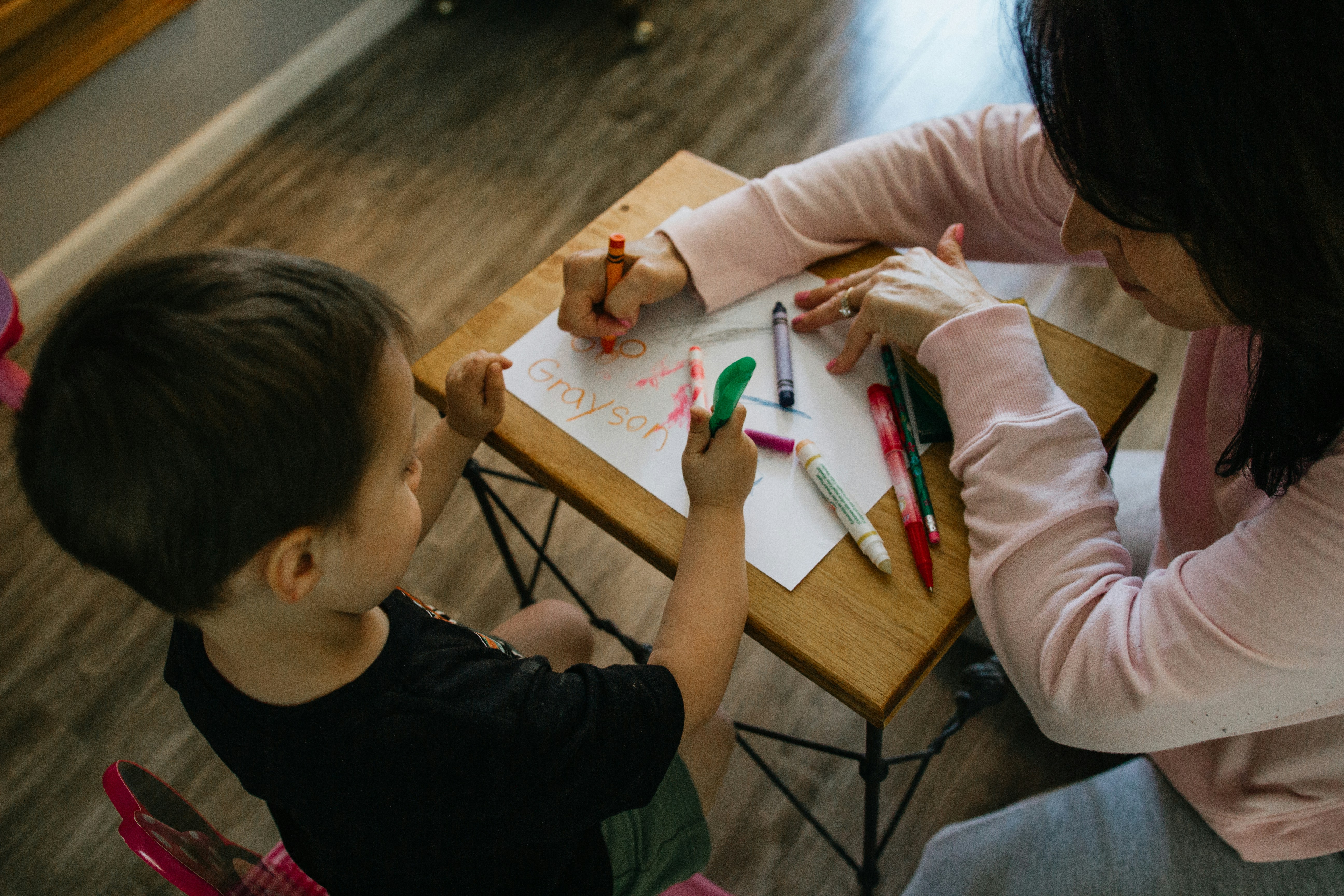 Parent and child looking at kindergarten classroom